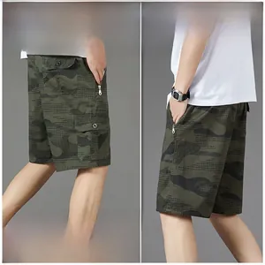 Detail view of men's camouflage cargo shorts with zipper pockets and grid texture