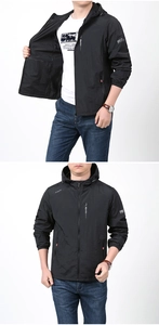 Detail view of lightweight black hooded sun protection jacket with zip pockets and elastic cuffs