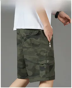 Detail view of cotton camouflage cargo shorts with large flap pocket and side zipper