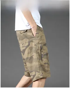 Detail of khaki camouflage cargo shorts showing a large zip pocket and ripstop texture