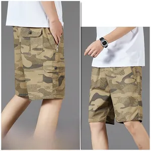 Detail of khaki camouflage cargo shorts featuring large side flap pockets and zipper details