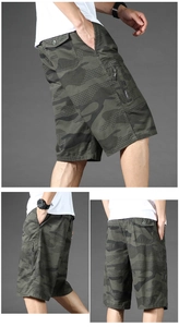 Close-up of camouflage cargo shorts featuring zipper side pockets and durable cotton fabric