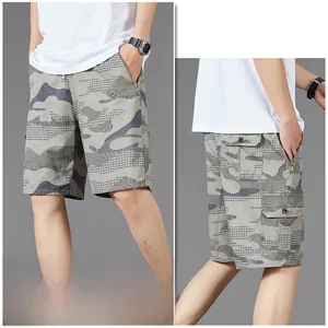Detail view of camouflage cargo shorts featuring zipper pockets and durable cotton fabric