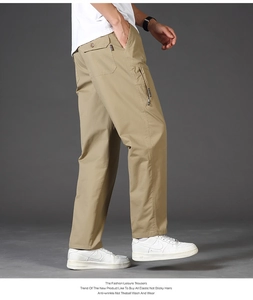 Detail view of men's khaki cotton cargo pants with side pockets and anti-wrinkle fabric