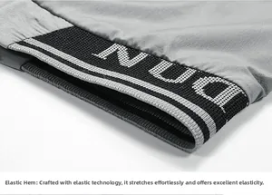 Detail of grey sport vest featuring high-elasticity ribbed hem with knit text patterns