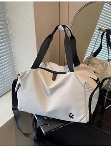White large capacity gym bag with black straps and round logo for yoga or travel