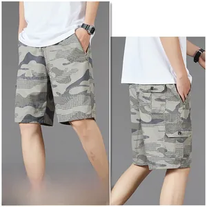 Detail view of cotton camouflage cargo shorts with functional side flap pockets