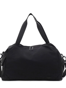 Minimalist black travel duffle bag with double handles and detachable shoulder strap