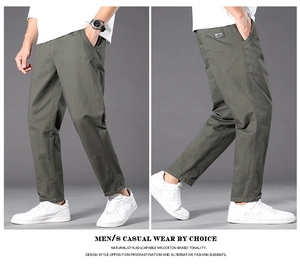Detail of olive green cotton casual pants with back pocket patch and straight fit