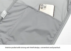 Detail of gray vest inner pocket showing high capacity for a smartphone and zipper closure