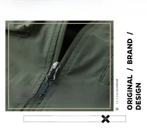 Detail of the durable zipper puller and woven fabric texture on a green outdoor vest