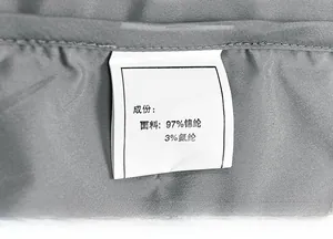 Macro detail of washing label showing 97% nylon and 3% spandex fabric composition