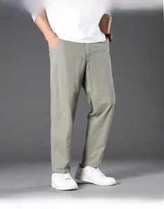 Detail of casual pants showing elastic anti-wrinkle fabric and urban straight cut