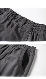 Detailed close-up of men's casual pants showing elastic waist and side pocket stitching