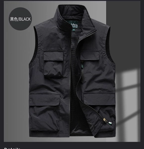 Detail of black fishing vest showing multi-pockets, stand collar and breathable mesh lining