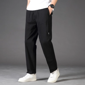 Men's summer cotton cargo pants in black with side zipper pockets and loose fit cut