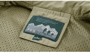 Close-up of military vest interior featuring breathable mesh lining and brand neck label