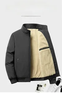 Close-up of black windproof jacket featuring thick beige sherpa fleece lining and high collar