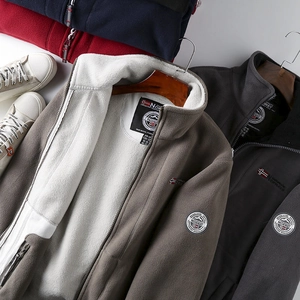 Detail of multi-color thick fleece jackets with warm white lining and Norway badges