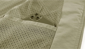 Detail view of the breathable mesh inner pocket with a smartphone inside for storage