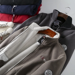 Detail view of thickened double-layer fleece jackets with Norway embroidery and stand collar