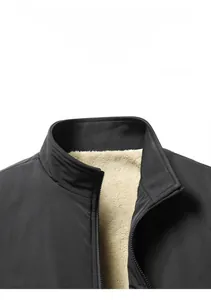 Detail of men's winter jacket showing stand collar and warm white fleece lining