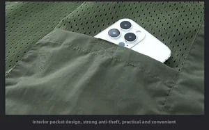 Detail of army green fishing vest featuring a secure interior anti-theft pocket for phones