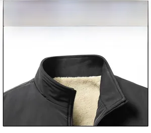 Detailed close-up of stand-up collar with thick fleece lining on black winter jacket
