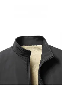 Close-up of men's winter jacket stand collar with thick fleece lining and metal zipper