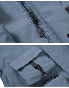 Detail of high-quality zipper and 3D pocket with hook on blue outdoor utility vest