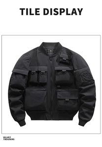 Detail of black tactical bomber jacket with multi-pocket design and metal D-rings