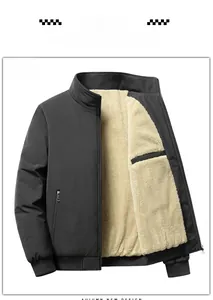 Detail view of men's black stand collar jacket showing beige faux fur lining texture