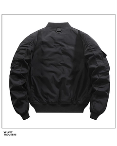 Detail view of black bomber jacket back with metallic D-ring and windproof texture