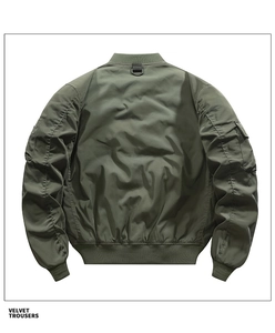 Detail view of military green bomber jacket back with nylon texture and utility D-ring