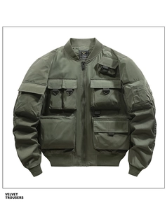 Detailed view of cargo pockets on a green military pilot bomber jacket with ribbed cuffs