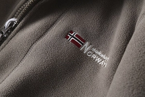 Detailed view of Norway flag embroidery and zipper on thick double-layer fleece jacket