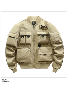 Detail of khaki cargo pilot jacket featuring 3D utility pockets and metal D-ring attachment