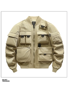 Detail view of khaki bomber jacket featuring multi-pocket design and D-ring utility accents