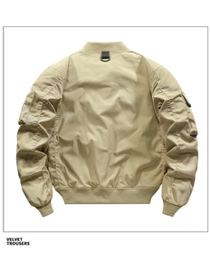 Rear view of khaki bomber jacket featuring ribbed hem and utility zipper pocket on sleeve