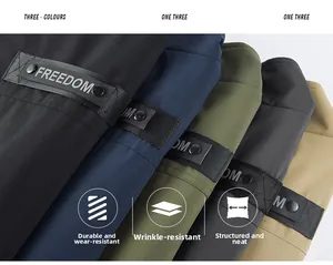 Close-up of durable multi-color vest fabric with FREEDOM ribbon detail and metal buckle