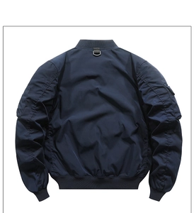 Detail view of the navy bomber jacket back with knit collar and metal D-ring accent