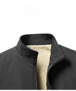 Detailed macro view of the warm fleece lining and stand collar on the men's winter jacket