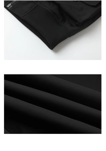Detail view of ribbed cuffs and high-quality fabric texture on black bomber jacket