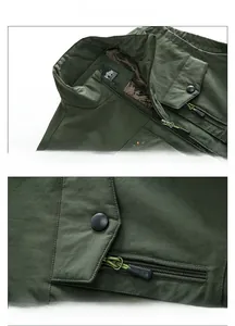 Detail der armygrünen Outdoor-Weste mit windfestem Kragen, Netzfutter und glattem Reißverschluss