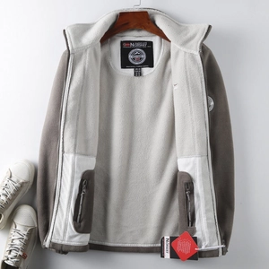 Detail of fleece jacket collar with NORWAY brand label and two-tone stitching design