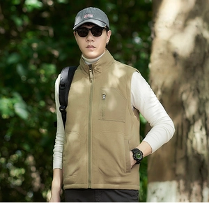 Detail of men fleece vest featuring a stand collar and vertical zipper chest pocket