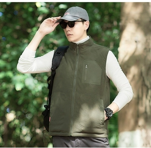 Close-up of army green men fleece vest featuring a stand collar and functional zip pocket