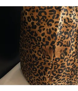 Close-up of leopard print canvas fabric texture and pattern detail for tote bag
