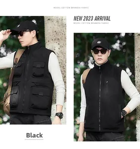 Detail view of black multi-pocket outdoor vest made from durable cotton spandex fabric