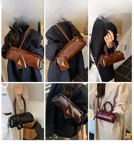 Detailed views of vintage cylinder bags in dark brown and black leather finishes